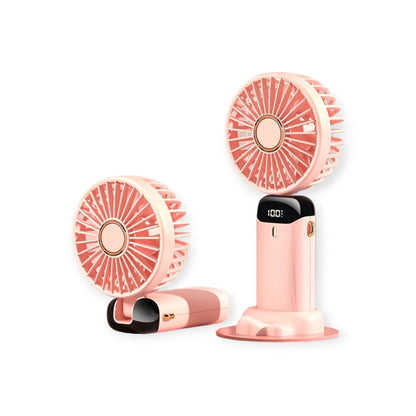 Portable small pink table fan for office and personal use.